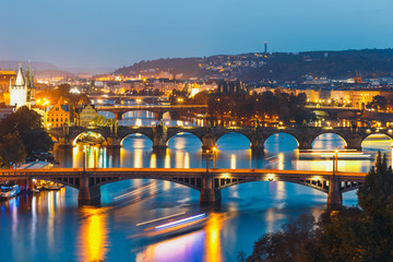 View of  bridges with historic Charles Bridge and Vltava river at night in Prague, Czech Republic