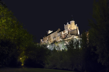 Fototapeta na wymiar Long exposure of Segovia Alcazar in Spain with the only illumination of street lights. In 1985 the old city of Segovia and its Aqueduct were declared World Heritage Site