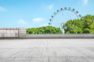 Poster Empty floor square and playground ferris wheel in the city park © ABCDstock