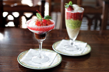 Two glasses of berry and fruit mousses