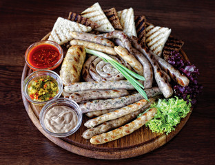 A bunch of meaty sausages and toasted bread