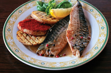 A plate of mackerel with grilled potatoes