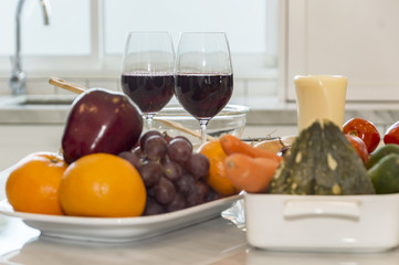 Fresh fruit, vegetable and red wine glass.