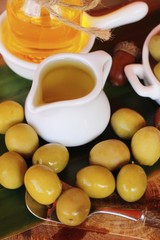 Olive oil for health on wood background