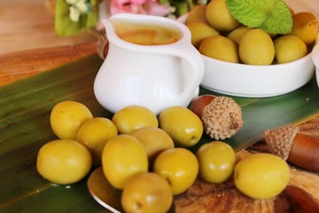 Olive oil for health on wood background