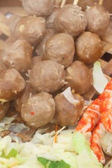 Meatballs and sausages steamed in the market