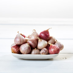 Fresh healthy garlic on white table