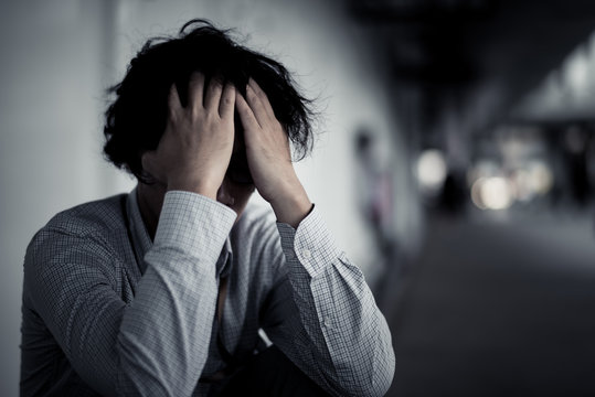 business man is stressed from his work. depression and anxiety concept.