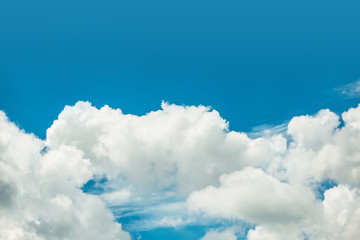 Naklejka na ściany i meble Fantastic soft white clouds against blue sky background