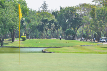 Golfer in Tee shot action on Tee off.
