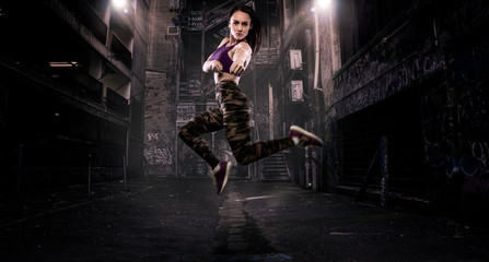 Fototapeta na wymiar Young fit woman jumping for joy