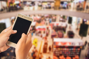 people playing,using a mobile phone  in the shopping mall with fun, relax and happy.