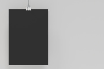 Blank black poster with binder clip mockup on white background