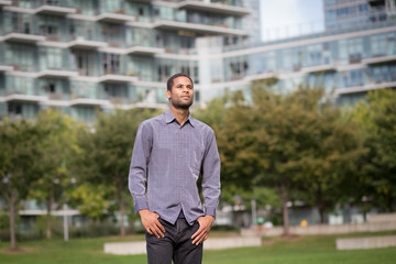 Portrait of young African American man in residential neighborhood in the city