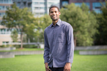 Portrait of young African American man in residential neighborhood in the city