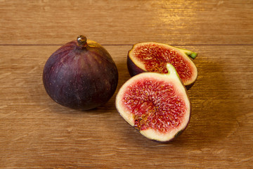 Ripe figs on a wooden background