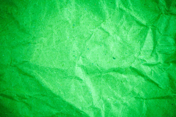 Green vignette crumpled paper.