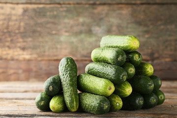 Fresh cucumbers on grey wooden table