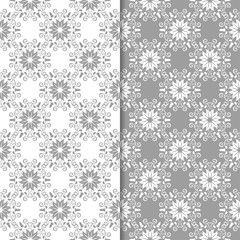 White and gray floral backgrounds. Set of seamless patterns