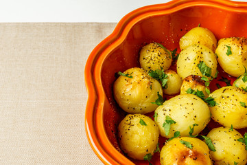Oven-roasted potatoes with spice on a table , top view. Cooking concept.