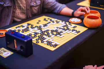 Chinese GO board game  close up view of playing.
Weiqi or Weichi 