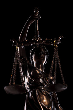 the blind goddess of justice holding the scales