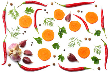 mix red hot chili peppers with parsley and sliced carrot and garlic isolated on white background top view