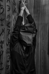 A Man With His Hands Tied Hanging From The Ceiling Buy