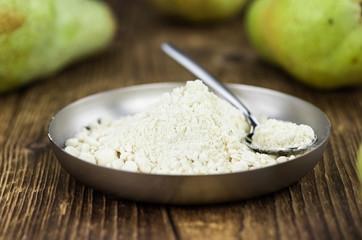 Portion of healthy Pear powder (selective focus; close-up shot)