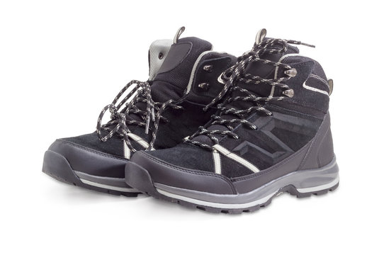 Black trekking boots on a white background