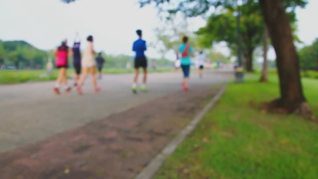 Running and walking blurred  focus with   exercise at parks outdoor in morning ,concept for health care