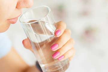 Young woman drinking water