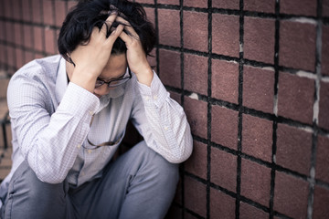 business man is stressed from his work. depression and anxiety concept.