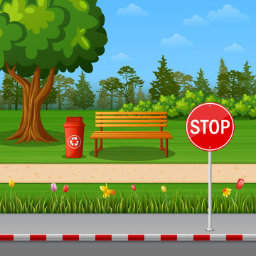 Park scenery with stop sign on town roadside and bench