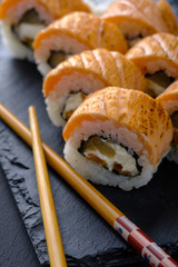 Fresh and tasty traditional Japanese sushi rolls close up.