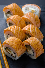 Fresh and tasty traditional Japanese sushi rolls close up.