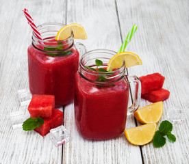 Jars with watermelon smoothie