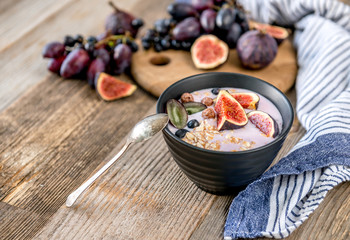 An useful dessert - yogurt, muesli and figs with grapes