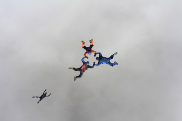 Naklejka na ściany i meble Skydivers in the sky