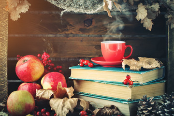 Autumn still life with a cup of coffee, apples and autumn leaves. Autumn background.