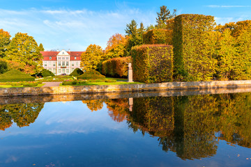 Fototapeta na wymiar Abbots Palace built in the rococo style and located in Oliwa park. Autumn scenery. Gdansk, Poland.