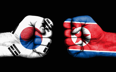 Conflict between South Korea and North Korea - male fists