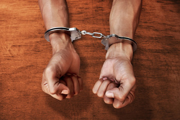 Hands in handcuffs