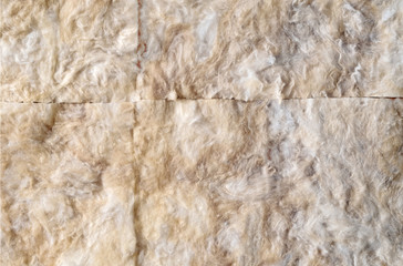 Noise insulation of walls.
Horizontally, the front view. Sound absorbing mats made of stone wool are attached to the wall of the living room.