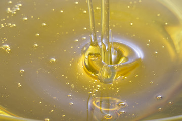 Closeup of olive oil waterfall.