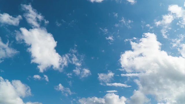Clouds on top of the blue sky are created and photographed by Time-lapse