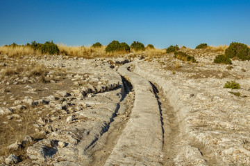 Wheel marks over rocks from ancient civilization