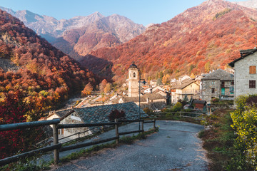 Piedicavallo, Italy - October 20, 2017: Rustic alpine village of Piedicavallo in the autumn season between the Italian Alps - obrazy, fototapety, plakaty