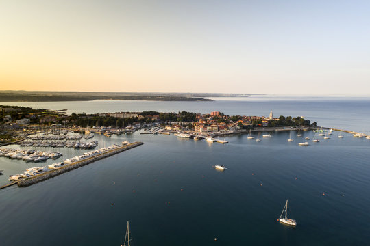 aerial drone view of sunrise over novigrad in summer