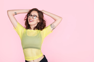 Brunette girl in glasses dancing